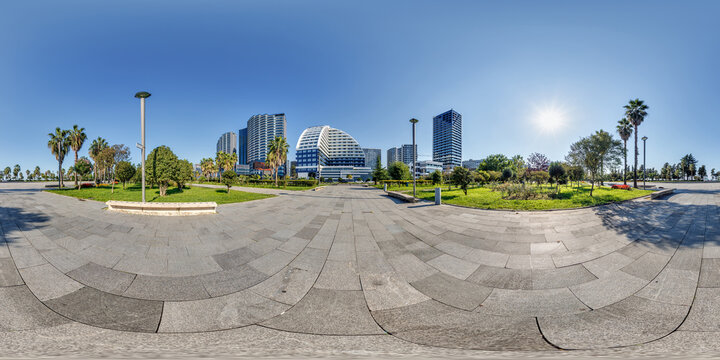 360 seamless hdri panorama view on pedestrian path near seashore or ocean with skyscrapers with blue sky and good weather in equirectangular spherical projection, ready AR VR virtual reality content