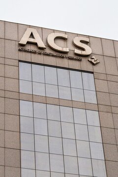Madrid, Spain - October 16, 2025: Close-up view of the ACS company logo on the facade of a modern office building in Madrid, Spain