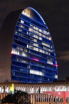 Madrid, Spain; October 20, 2025: Detailed view of the BBVA tower in Madrid at night, featuring illuminated blue glass panels and a modern corporate design