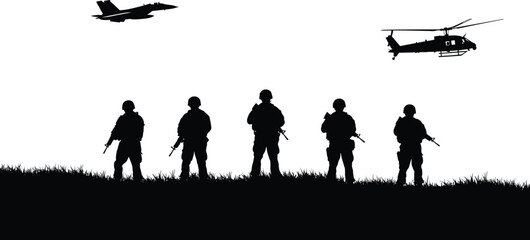 Silhouette of soldiers standing on a grassy hill with a fighter jet and helicopter flying in the sky above