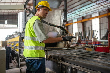 Safety inspection in manufacturing facility worker assessing machinery operations industrial environment real-time monitoring