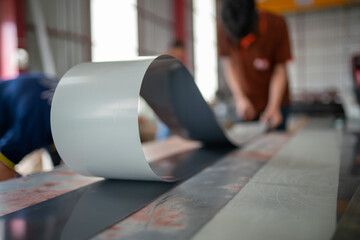 Manufacturing process of metal sheets factory floor industrial photography workshop environment close-up view production techniques
