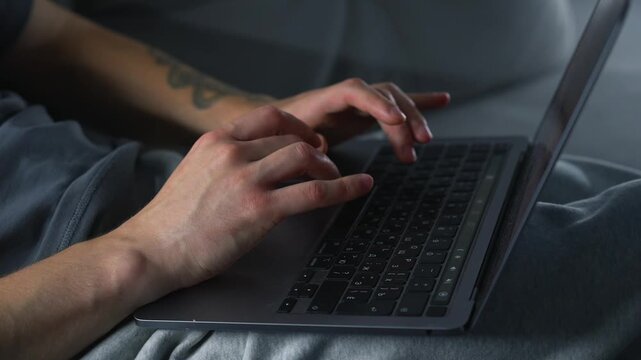 A hacker working on a laptop.
The Internet is online.
A freelancer works from home on a gray sofa.
A man with a laptop