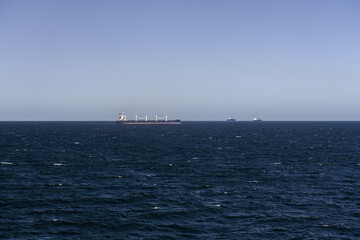 Large cargo ship sailing across the Strait of Gibraltar