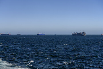 Large cargo ship sailing across the Strait of Gibraltar