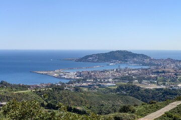 Obraz premium Coastal panorama of Ceuta with the port, hills, and city skyline.