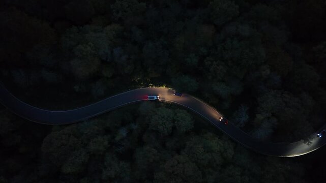 Curvy Forest Road at Night with Car Lights &ndash; Aerial View