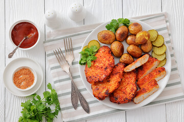 Paprika-Rubbed Pork Chops on plate with potatoes