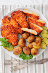 Paprika-Rubbed Pork Chops on plate with potatoes