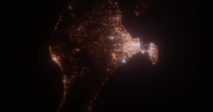 Bali (Indonesia) aerial view at night. Top view on modern city with street lights. Camera is zooming out, rotating clockwise. Vertical video. The north is on the left side