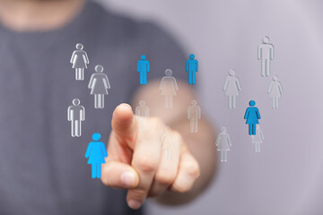 A hand selecting a member in a digital human network. Highlighting concepts of teamwork, inclusion, and business connection.