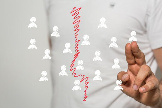 Conceptual image depicting team division, conflict, separation, disagreement, and business problems. Ideal for illustrating conflict