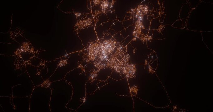 Karaganda (Kazakhstan) aerial view at night. Top view on modern city with street lights. Camera is zooming out, rotating clockwise