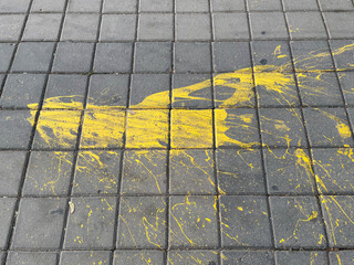 Stains of yellow paint on the floor