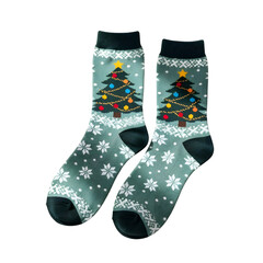 Green christmas socks displaying festive tree and snowflake pattern