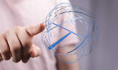 Person's finger interacting with abstract digital globe representing worldwide connections, technology, and global data flow. Symbolizing commun