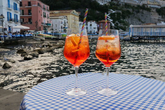 Cocktail aperol spritz on an italian terrace in the harbour of Marina Grande in Sorrento, Italy