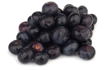 pile of blueberries on a white background