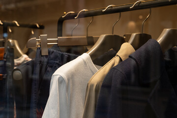 Clothing display with shirts and jackets on hangers