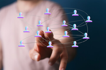 Visualize connection and relationships, global concepts. A finger touching an abstract network of figures, symbolizing communication and teamwor