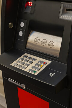 Modern ATM machine with keypad and transaction icons