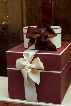 Elegant gift boxes with luxurious ribbons in shop