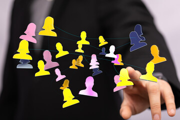 Abstract digital networking connection concept. Person in a suit interacting with a network of...