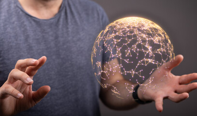 Person holding a glowing sphere, representing global network, data connection, technology, and...