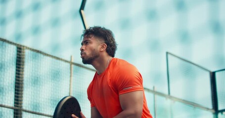 Man, padel and tennis court for match, ball or low angle for training, game and sports in summer. Person, athlete and outdoor with racket, equipment and gear for exercise with fitness for competition - Powered by Adobe