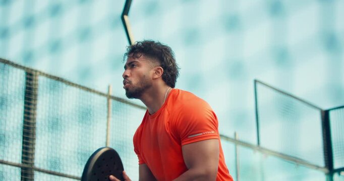 Man, padel and tennis court for match, ball or low angle for training, game and sports in summer. Person, athlete and outdoor with racket, equipment and gear for exercise with fitness for competition