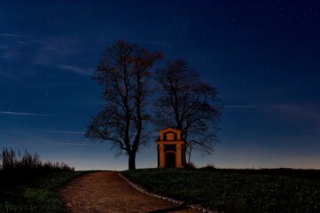 Chapel of St. Florian in Pelhřimov, clear, November night, silhouettes of trees, stars
