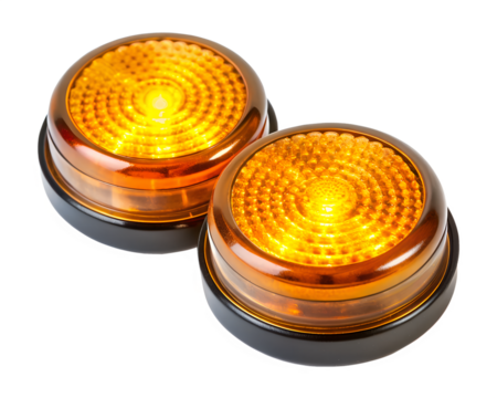 Two amber warning lights with circular pattern isolated on transparent background
