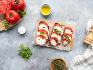 Traditional caprese bruschetta with fresh tomatoes, mozzarella, and basil