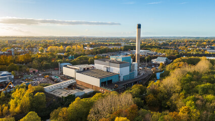 Aerial view of an Energy from Waste generation plant in Wolverhampton, UK, with chimney and surrounding buildings, a factory converting non recyclable waste to energy