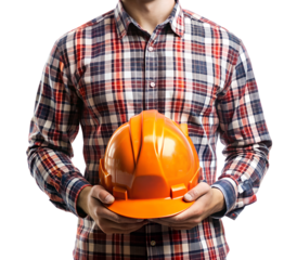 Construction worker holding an orange hard hat in his hands isolated on transparent background