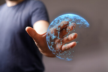 Hand holding glowing digital globe concept. Symbolizing global connection, communication, future,...