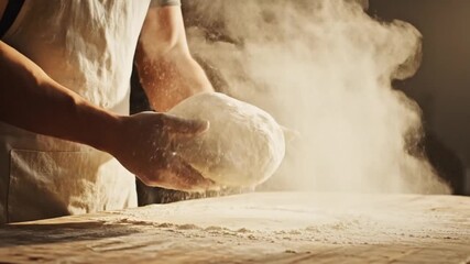 A baker kneading dough on a wooden table with flour dust in the air, warm lighting enhances the scene - Powered by Adobe