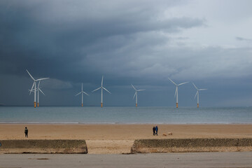 The North Sea coast at Redcar showing the wind turbines