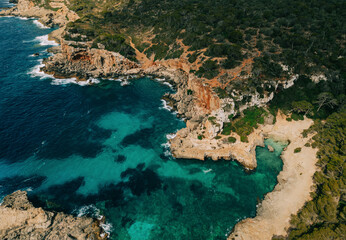 Aerial view of rocky coastline with turquoise sea