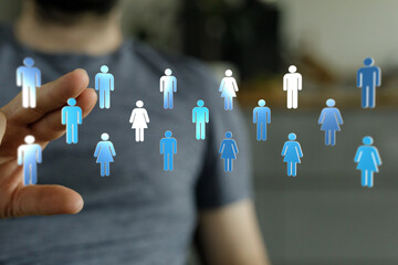 Concept of connection, global networking, and online communities with people icons in hand. Symbolizes teamwork and partnership, business relati