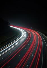 Long exposure streaks of bright car headlights and red taillights rushing along a dark, hazy highway road late at night, showing movement, dark, streaks, night