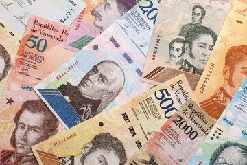 Venezuelan Bolivar currency money bills in big amount. VED currency banknotes with different denomination close up