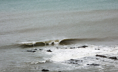 waves breaking on the rocks