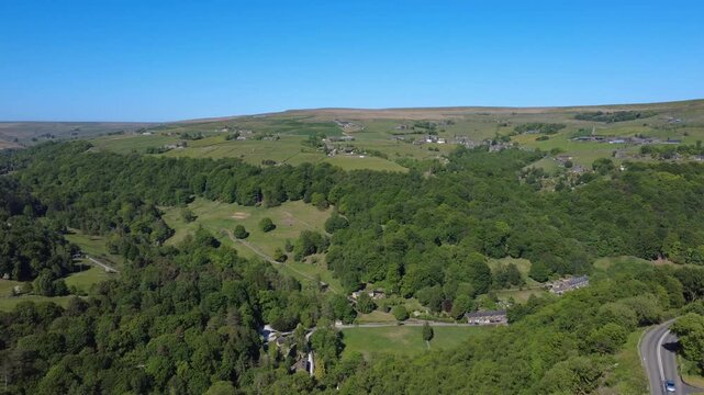 aerial scenic drone view of west yorkshire landscape with with the villages of Pecket Well in the distance