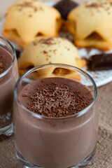 Homemade cookies with chocolate pudding and grated dark chocolate