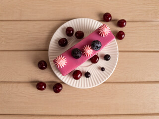 Top View of Cherry and Blueberry Cake with Pink Glaze