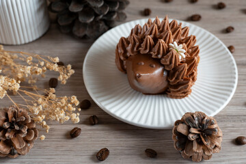 Rustic Chocolate Dessert with Coffee Beans and Pine Cones