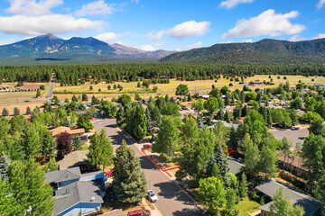 Aerial view of a residential area with mountains behind