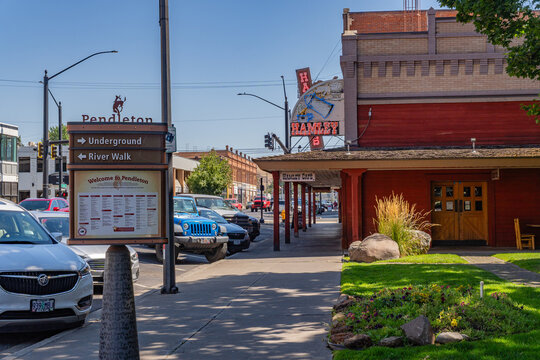 Pendleton, OR, US- August 12, 2025: Street scene in downtown of this small town with its quaint streets with 19th century brick buildings and trendy shops and restaurants.