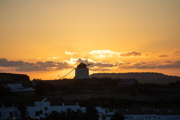 Molino viejo windmill silhouette at sunset in vejer © Tororio Stock
